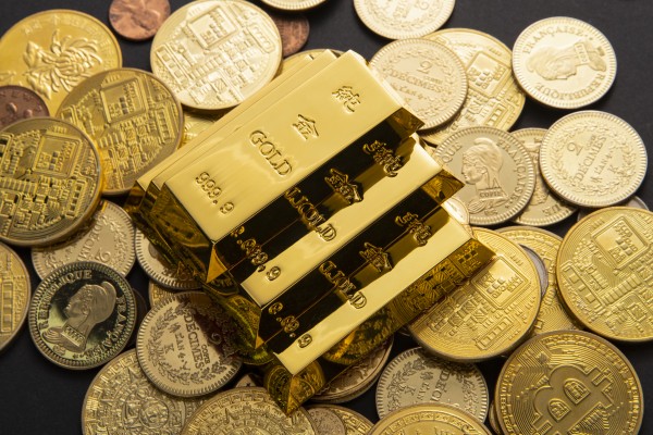 closeup-shot-of-a-pile-of-shiny-gold-coins-and-bars